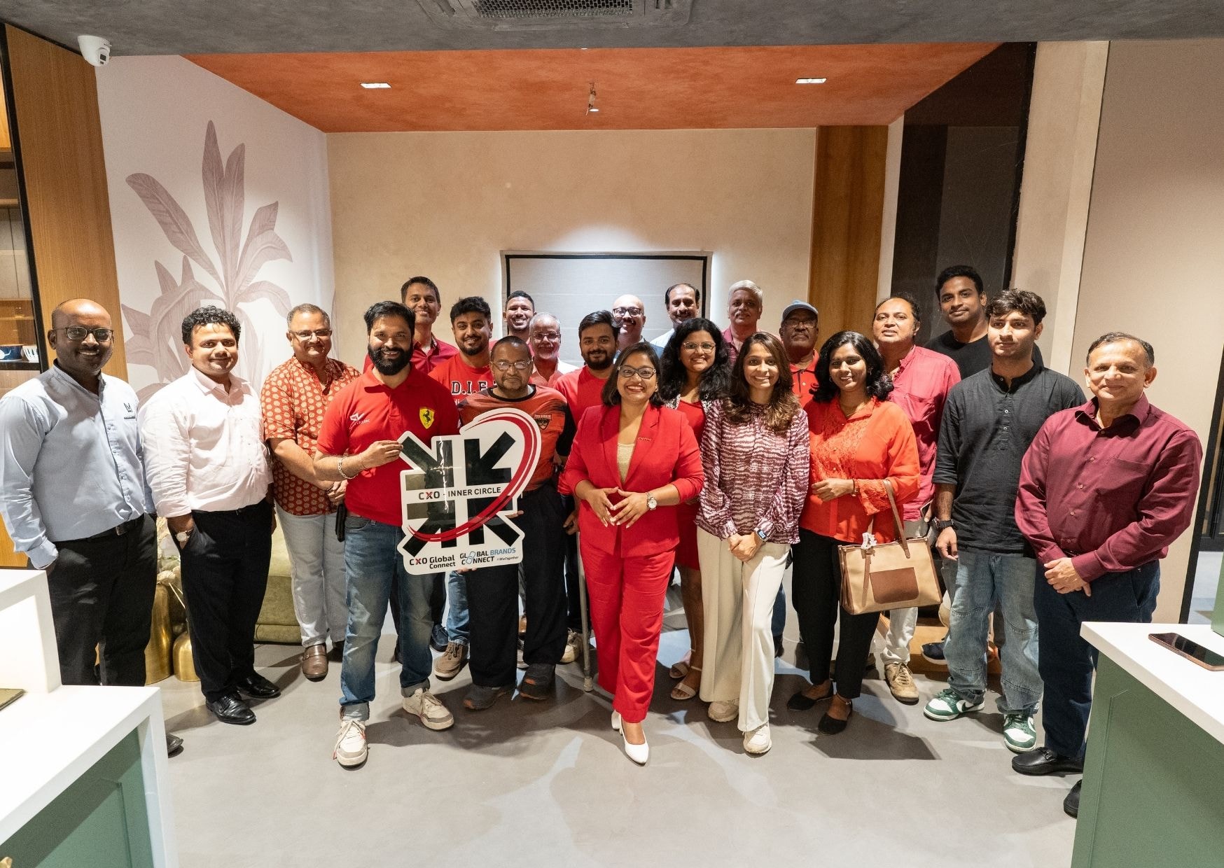 CXO Inner Circle — group photo at branded office event